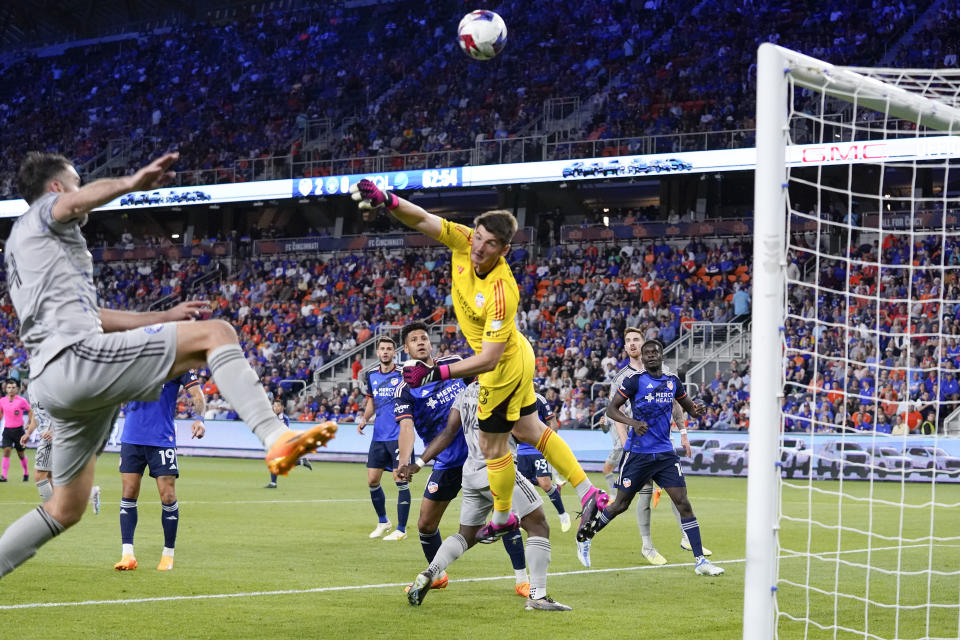 FC Cincinnati goalkeeper Roman Celentano (18) makes a save during the second half of an MLS soccer match against CF Montreal Wednesday, May 17, 2023, in Cincinnati. (AP Photo/Jeff Dean)