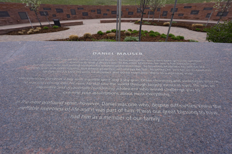 The plaque to honor Daniel Mauser, one of the 12 students killed during the massacre at Columbine High School nearly 25 years ago, is displayed at the Columbine Memorial Wednesday, April 17, 2024, in Littleton, Colo. Trauma still shadows the survivors of the horrific Columbine High School shooting as the attack's 25th anniversary approaches. (AP Photo/David Zalubowski)