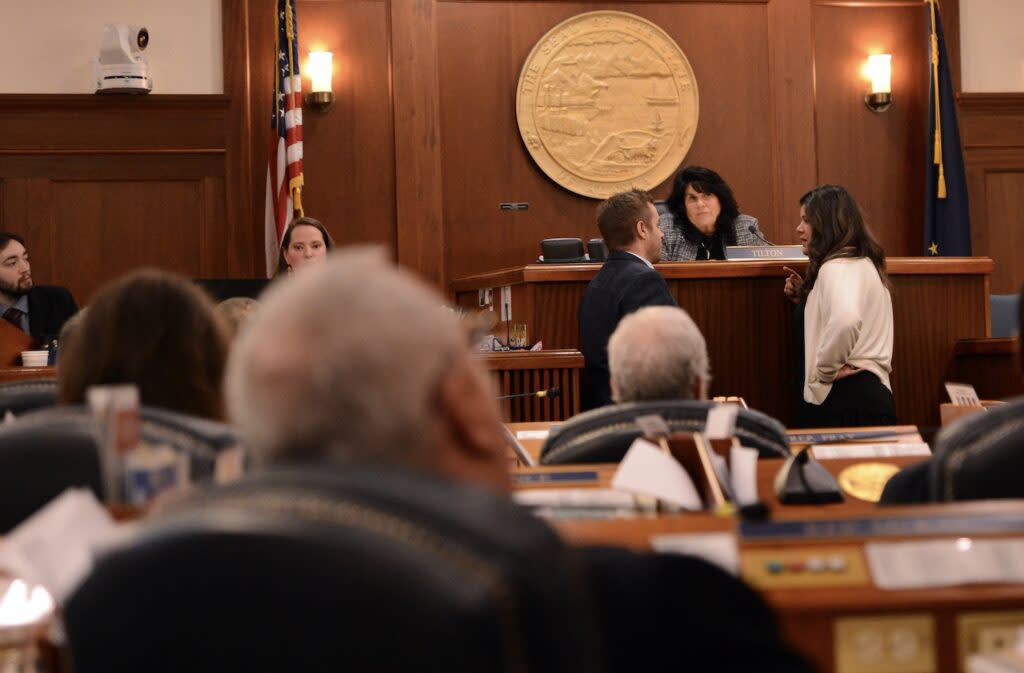 Reps. Jesse Sumner, R-Wasilla, and Jamie Allard, R-Eagle River, talk to Speaker of the House Cathy Tilton, R-Wasilla, during a break in the Alaska House of Representatives floor session on Monday, April 29, 2024. (Photo by James Brooks/Alaska Beacon)