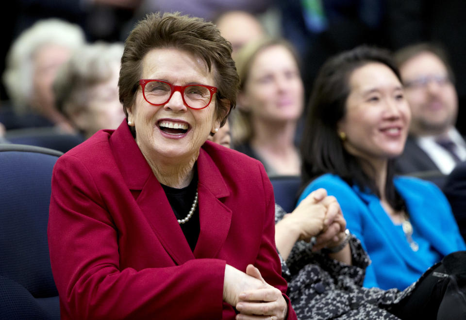 FILE - In this Jan. 29, 2016, file photo, tennis great Billie Jean King, left, laughs, reacting to President Barack Obama's remarks in the Eisenhower Executive Office Building on the White House complex in Washington.  Billie Jean King and partner Ilana Kloss have joined the Los Angeles Dodgers ownership group. The Dodgers made the announcement Thursday, Sept. 20, 2018. The tennis great says Dodgers owner and chairman Mark Walter and the organization have proven to be leaders in sports on and off the field.  (AP Photo/Manuel Balce Ceneta, File)