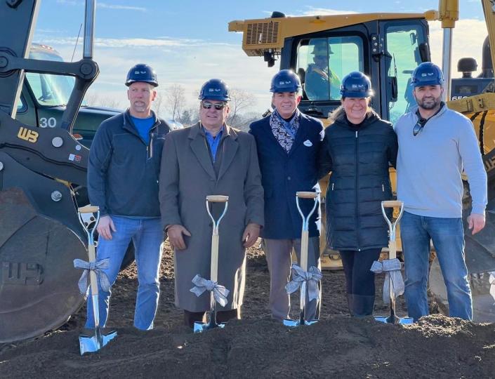 Hall of Fame Village CEO Michael Crawford, middle, is shown at a groundbreaking event in December for an indoor water park at the Hall of Fame Village in Canton, part of a development and entertainment campus being built around the Pro Football Hall of Fame.