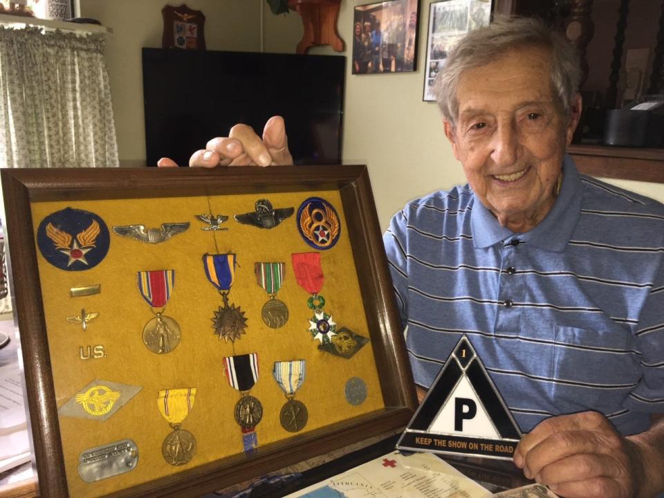 John DeFrancesco poses with his medals.