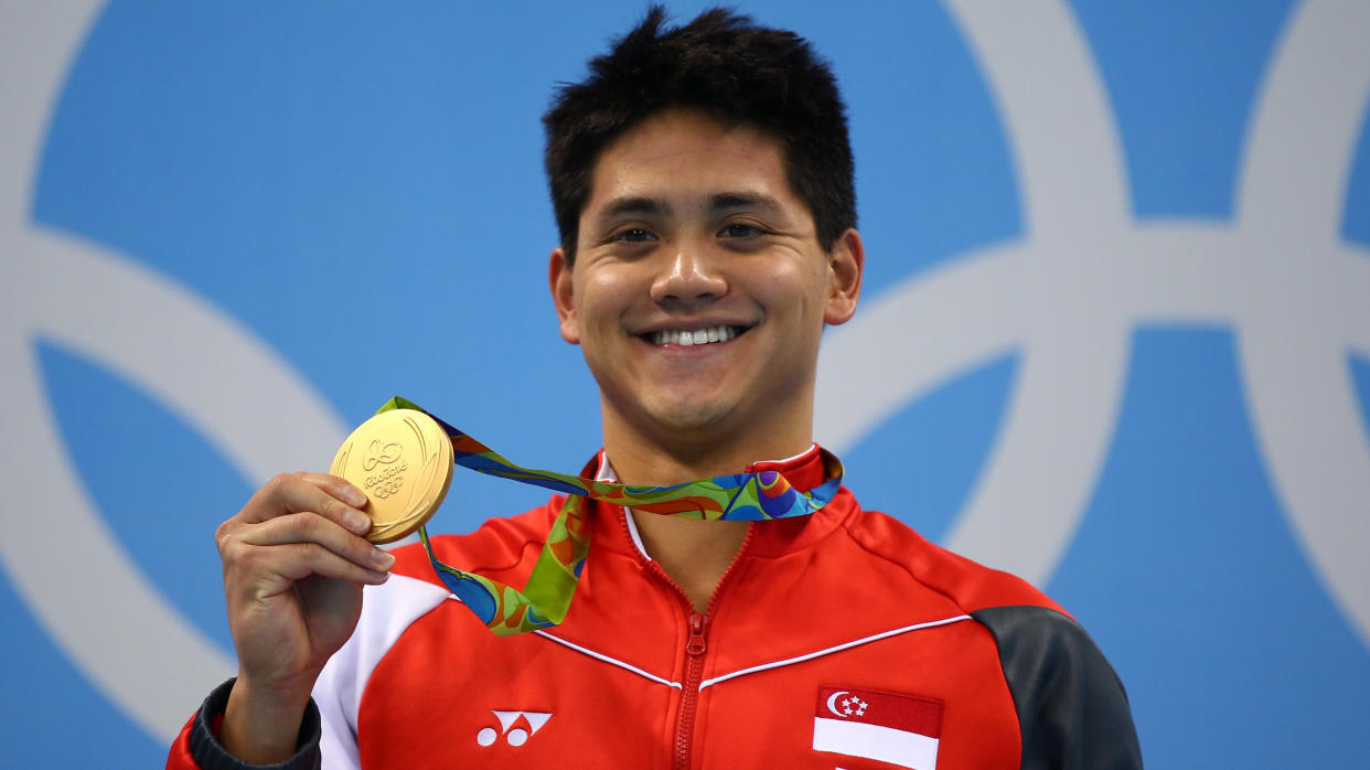 Singapore swimmer Joseph Schooling with his men's 100m butterfly gold medal at the 2016 Rio de Janeiro Olympics.