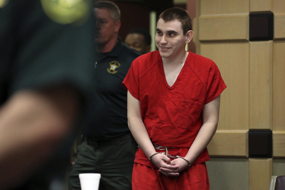 Parkland school shooting suspect Nikolas Cruz enters the courtroom for a hearing at the Broward Courthouse in Fort Lauderdale, Fla., Tuesday, Jan. 15, 2019. Cruz returned court this week for hearings on the Valentine's Day 2018 shooting at Marjory Stoneman Douglas High School in Parkland, Fla., and on accusations he assaulted a corrections officer. (Amy Beth Bennett/South Florida Sun-Sentinel via AP, Pool)