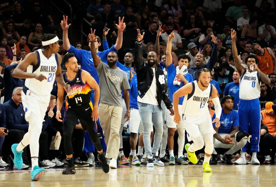 May 15, 2022; Phoenix, Arizona, USA; The Dallas Mavericks bench celebrates a three-pointer against the Phoenix Suns during game seven of the second round for the 2022 NBA playoffs at Footprint Center.