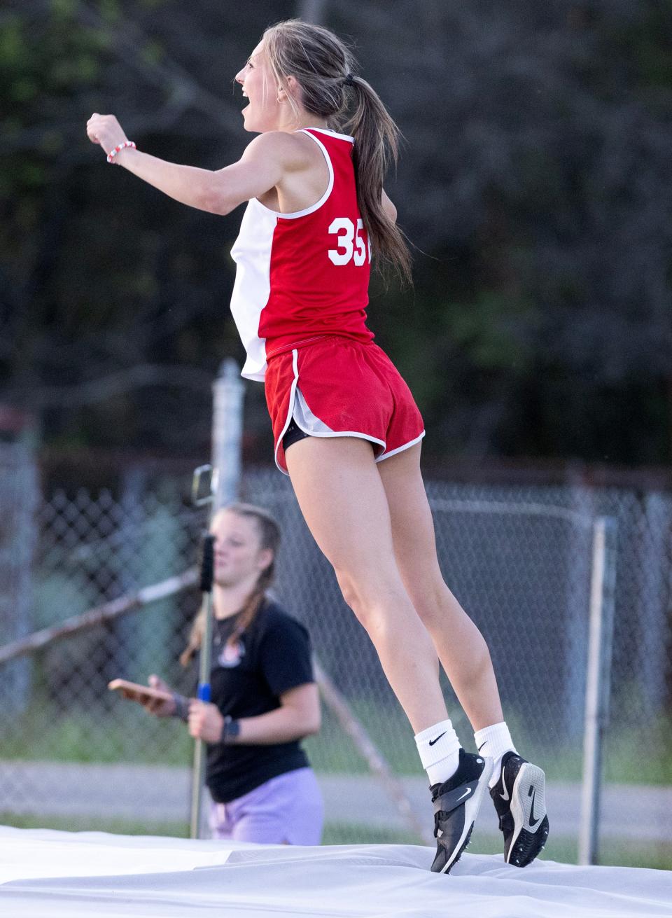 Northwest's Olivia Lazarus celebrate a good vault at the PAC-7 Track and Field Championships.