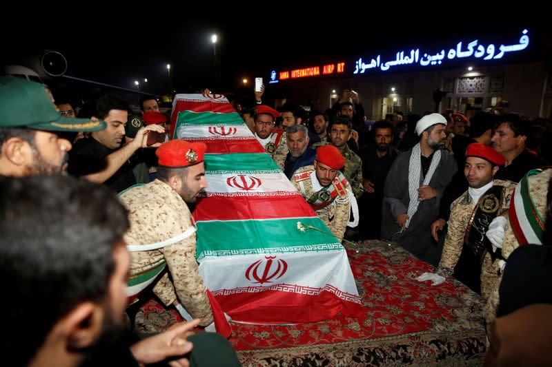 FILE PHOTO: Iranian mourners gather arround the coffin of the Iranian Major-General Qassem Soleimani, head of the elite Quds Force, who was killed in an air strike at Baghdad airport, at Ahvaz international airport, in Ahvaz