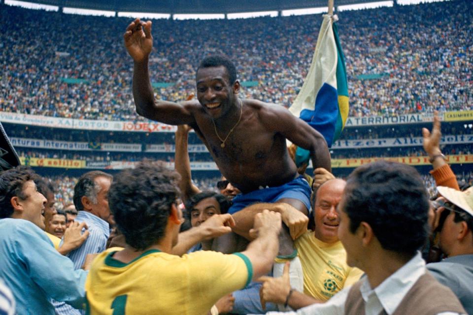 Brazil’s Pele is hoisted on the shoulders of his teammates after Brazil won the World Cup final against Italy, 4-1, in Mexico City’s Estadio Azteca, June 21, 1970 (AP)