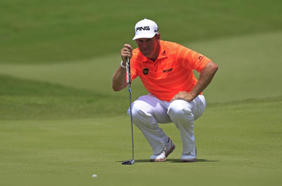 Lee Westwood of England lines up his putt on the seventh green during the third round of the Malaysian Open golf tournament at Kuala Lumpur Golf and Country Club in Kuala Lumpur, Malaysia, Saturday, April 19, 2014. (AP Photo/Lai Seng Sin)