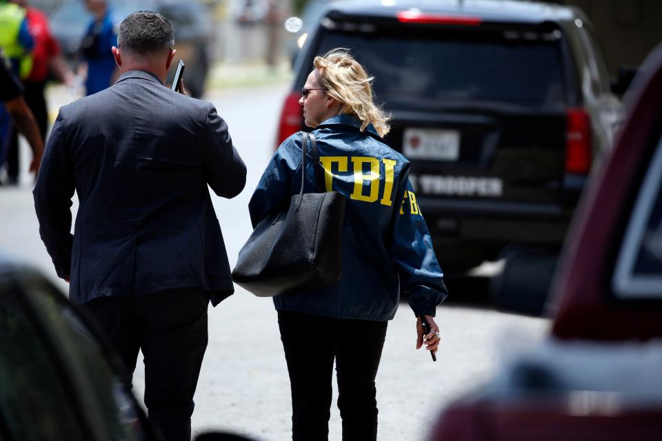 Law enforcement personnel, including the FBI, arrive at Robb Elementary School following a shooting, Tuesday, May 24, 2022, in Uvalde, Texas.