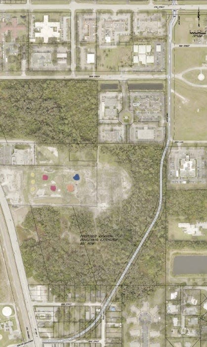 A proposed new route to the 37th Street medical corridor is outlined on this aerial picture furnished by Indian River County. The road would connect to U.S. 1 and Aviation Boulevard, lower left, pass to the east of BigShots golf, center-left, and connect with northbound Dr. Hugh McCrystal Drive, top right,  just west of Cleveland Clinic Indian River Hospital.