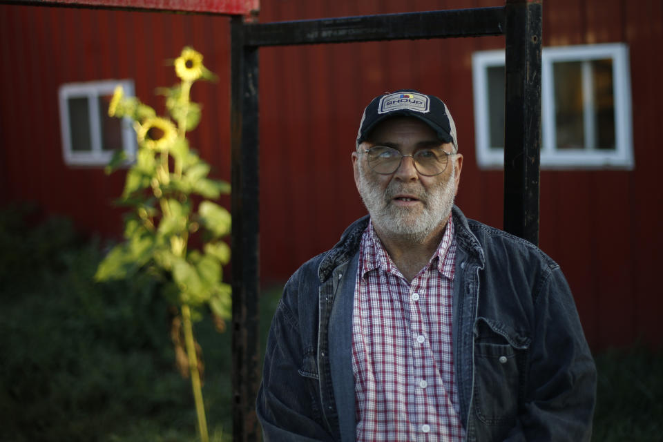In this Thursday Aug. 15, 2019 photo, dairy farmer Fred Stone stands for a portrait at his farm in Arundel, Maine. Fred Stone and his wife, Laura, whose farm is contaminated by toxic chemicals known collectively as PFAS, so-called "forever chemicals," have tested high for PFAS in their blood. (AP Photo/Robert F. Bukaty)