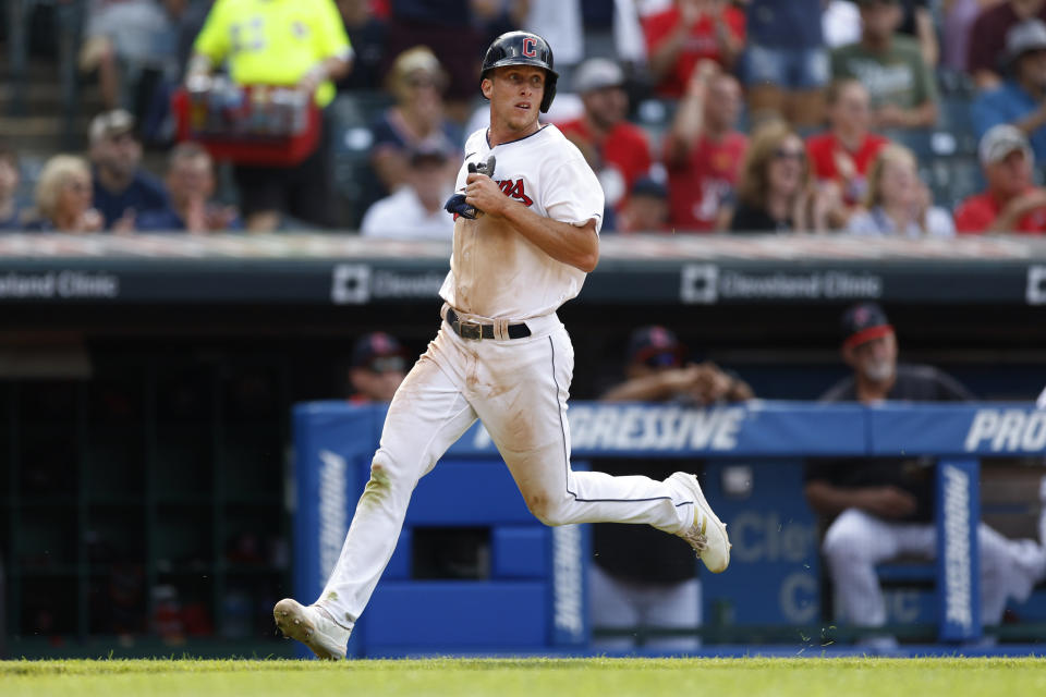 Cleveland Guardians' Myles Straw scores on a single by Jose Ramirez off Detroit Tigers starting pitcher Drew Hutchison during the fifth inning in the first baseball game of a doubleheader Monday, Aug. 15, 2022, in Cleveland. (AP Photo/Ron Schwane)