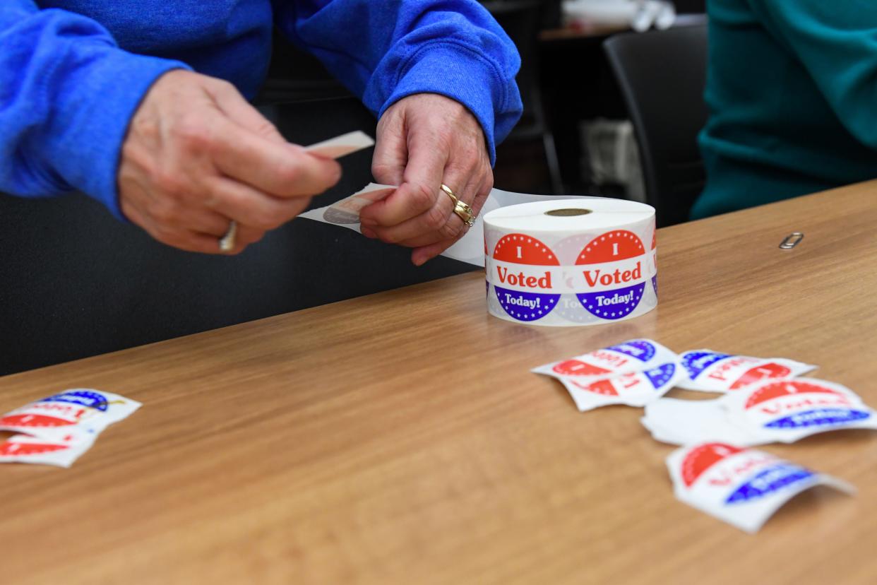 “I Voted” stickers are separated for voters on Tuesday morning, November 8, 2022, at the downtown Siouxland Public Library branch in Sioux Falls.