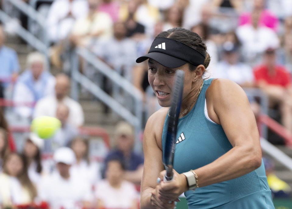 Jessica Pegula, of the United States, hits a return to Liudmila Samsonova, of Russia, in the women's final of the National Bank Open tennis tournament in Montreal, Sunday, Aug. 13, 2023. (Christinne Muschi/The Canadian Press via AP)