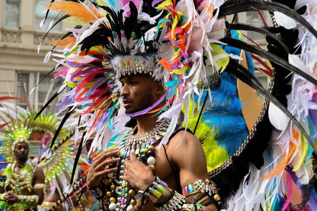 A costumed masquerader participates in the Notting Hill Carnival parade. (Photo: Clara Watt for HuffPost)