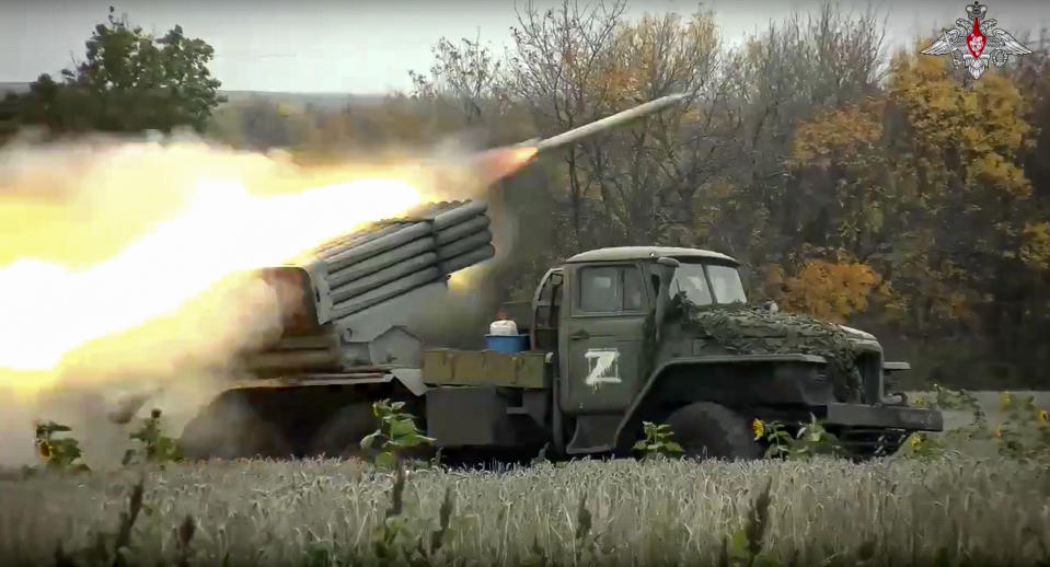 FILE - This handout photo taken from video released by Russian Defense Ministry Press Service on Oct. 4, 2022, shows a Grad multiple rocket launcher firing at Ukrainian troops at an undisclosed location. (Russian Defense Ministry Press Service photo via AP, File)