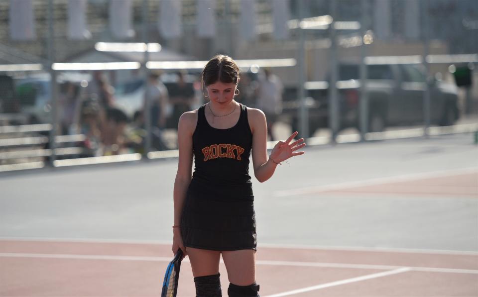 Rocky Mountain girls tennis player Nora Johnson reacts after a shot during a Colorado 5A first-round team playoff match against Arapahoe on April 24 at Rocky Mountain High School in Fort Collins.