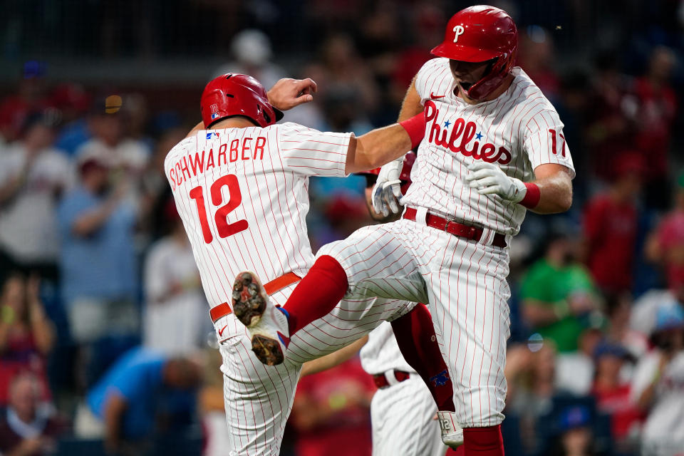 Philadelphia Phillies' Rhys Hoskins, right, celebrates with Kyle Schwarber after hitting a three-run home run offMiami Marlins' Trevor Rogers during the fourth inning of a baseball game Tuesday, June 14, 2022, in Philadelphia. (AP Photo/Matt Rourke)