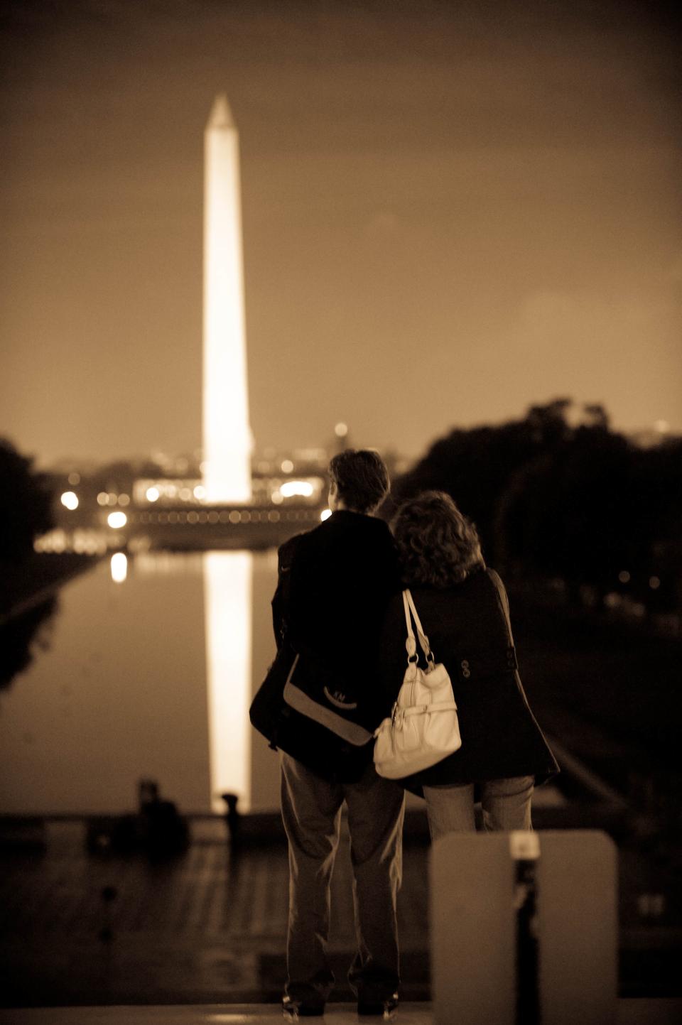 A couple looks toward the Washington Monument from the steps of the Lincoln Memorial in Washington, D.C., after the election of Barack Obama on Nov. 4, 2008.