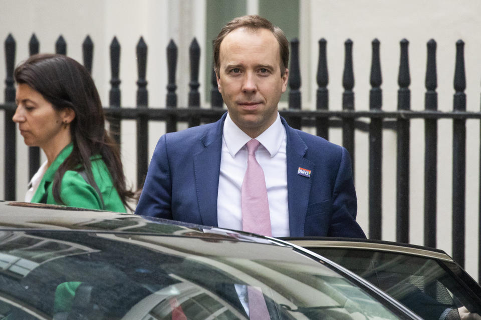 LONDON, ENGLAND  - MAY 01: Health Secretary Matt Hancock leaves 10 Downing Street with aide Gina Coladangelo after the daily press briefing on May 01, 2020 in London, England. Mr Hancock announced that the government's pledge to conduct 100,000 Covid-19 tests per day had been successful. British Prime Minister Boris Johnson, who returned to Downing Street this week after recovering from Covid-19, said the country needed to continue its lockdown measures to avoid a second spike in infections. (Photo by Dan Kitwood/Getty Images)