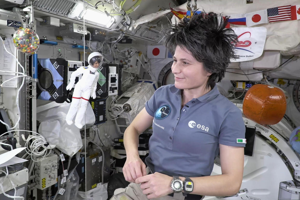 Astronaut Samantha Cristoforetti, with her lookalike Barbie doll on the International Space Station