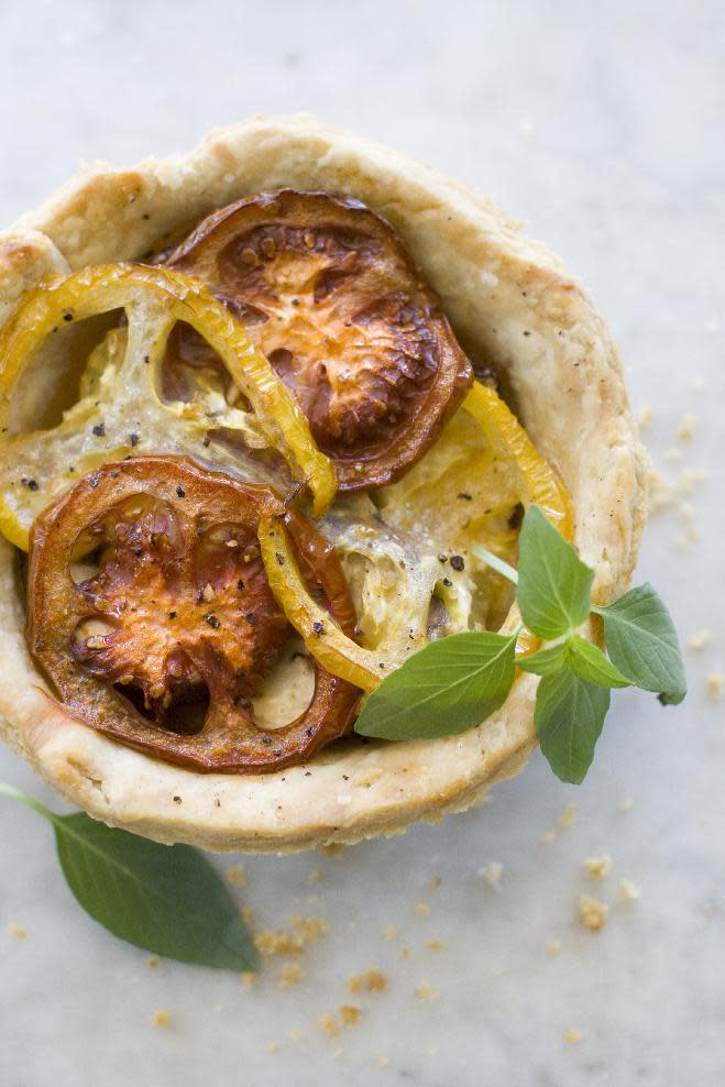 Caramelized Onion, Eggplant and heirloom tomato tart.This Aug. 5, 2013 photo shows caramelized onion, eggplant and heirloom tomato tart in Concord, N.H. (AP Photo/Matthew Mead)