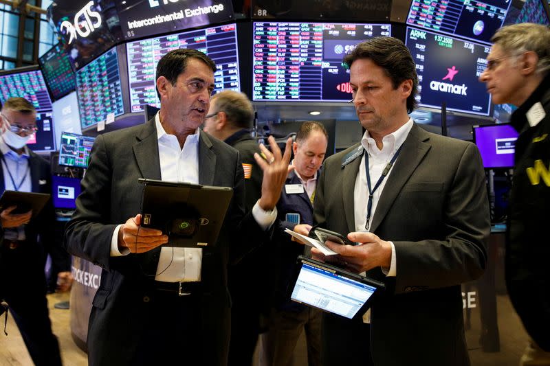 Traders work on the floor of the NYSE in New York