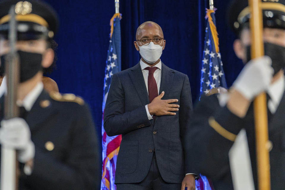 United States Attorney-elect for the Southern District of New York Damian Williams stands during the national anthem at his swearing-in ceremony, Friday, Nov. 19, 2021, in New York. (AP Photo/Jeenah Moon)