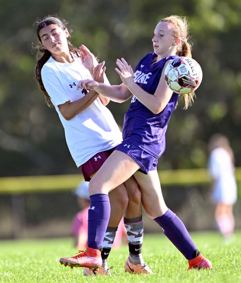 Paige Meda of Bourne collides with Grace Gaspar of Case. girls soccer.