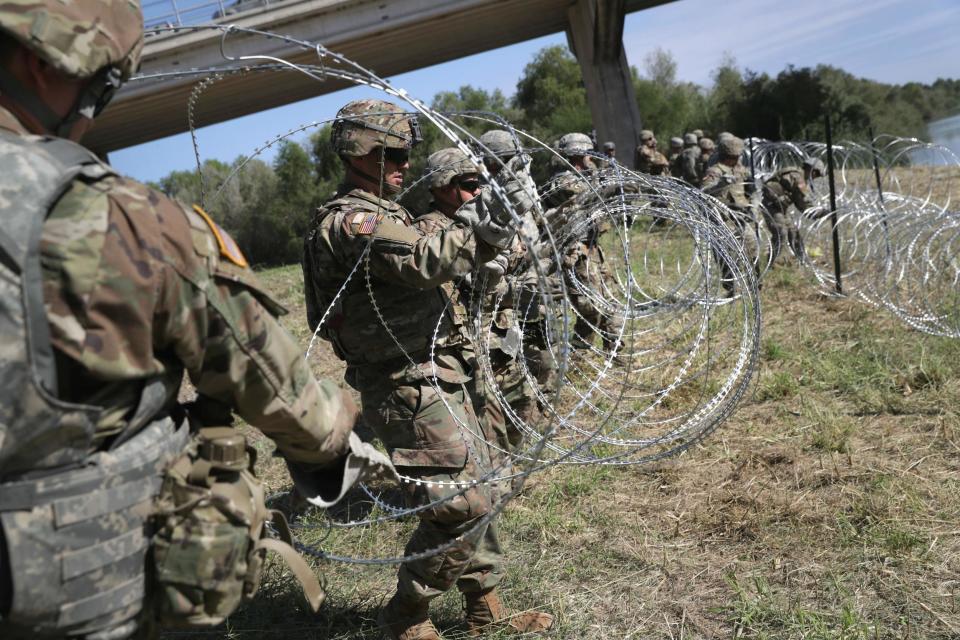 US troops dispatched by Trump install razor wire on Mexico border in 'political stunt' days ahead of midterm elections