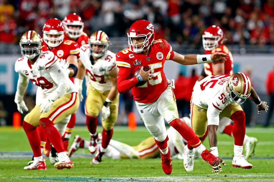 Feb 2, 2020; Miami Gardens, Florida, USA; Kansas City Chiefs quarterback Patrick Mahomes (15) runs the ball against San Francisco 49ers defensive tackle DeForest Buckner (99) during the fourth quarter in Super Bowl LIV at Hard Rock Stadium. Mandatory Credit: Matthew Emmons-USA TODAY Sports ORG XMIT: USATSI-424860 ORIG FILE ID: 20200202_pjc_se2_332.JPG