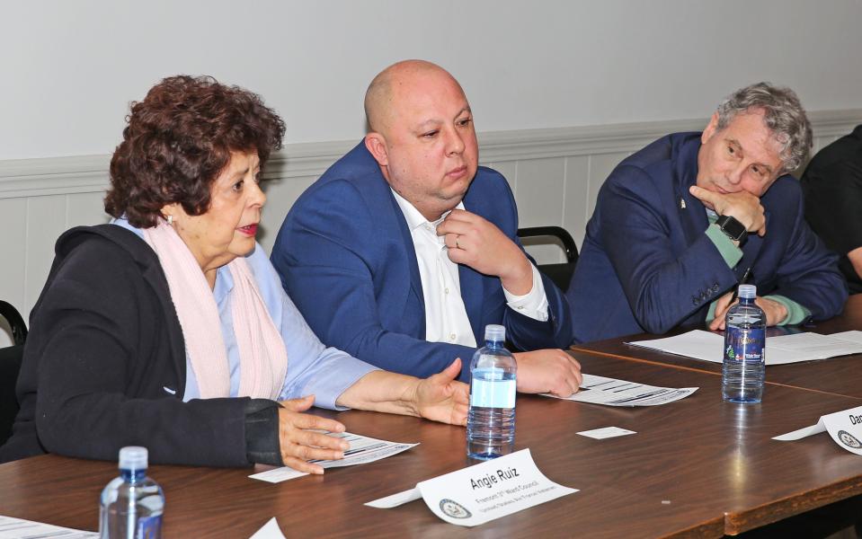 Angie Ruiz, Air Force veteran and Councilwoman for Fremont's 3rd Ward, left, voice her concerns about veterans' issues on Thursday. Fremont Mayor Danny Sanchez, center, and U.S. Sen. Sherrod Brown, right, along with many others, were on hand for a roundtable at VFW Post 2947.