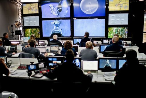 Crew members at the mission control watch Felix Baumgartner of Austria during his jump from the edge of space for Red Bull Stratos in Roswell, New Mexico, in this photo provided by www.redbullcontentpool.com. Baumgartner became the first man to break the sound barrier in a record-shattering, death-defying freefall jump