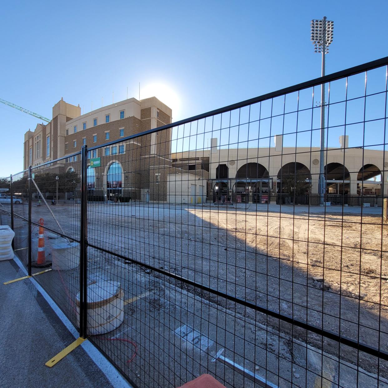 Construction fencing surrounds the site where a new visitors' locker room will be built at the northeast corner of Jones AT&T Stadium. That part of two-year, $242-million Texas Tech football project is targeted for completion in August.