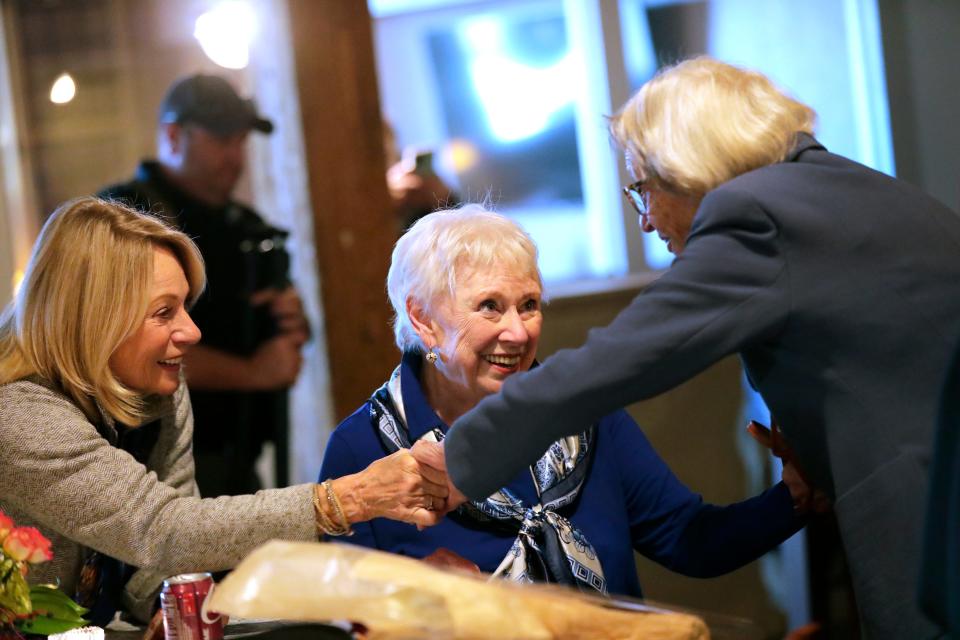 Rosemary Lloyd, 88, of Appleton celebrates earning her bachelor's degree from Marian University with niece Joan Lloyd, left, and friend Susan Brown on Nov. 9 in Appleton.
