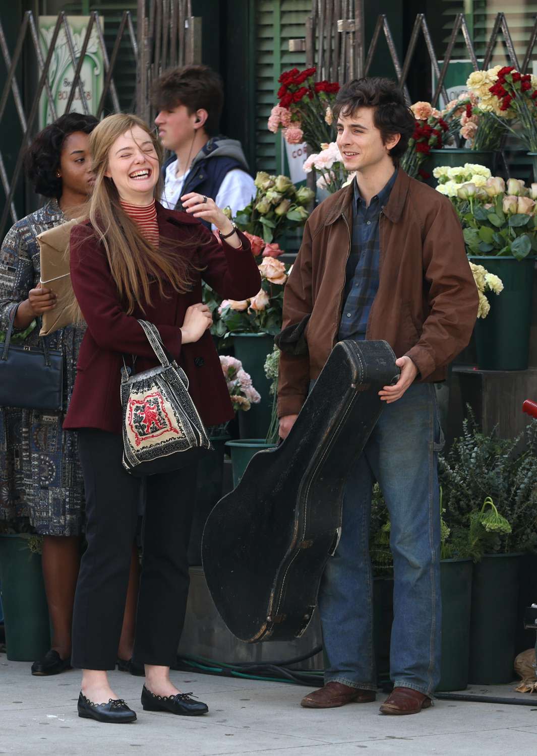 <p>Jose Perez/Bauer-Griffin/GC Images</p> Elle Fanning and Timothée Chalamet on the set of <em>A Complete Unknown</em> April 9, 2024, in Paterson, New Jersey