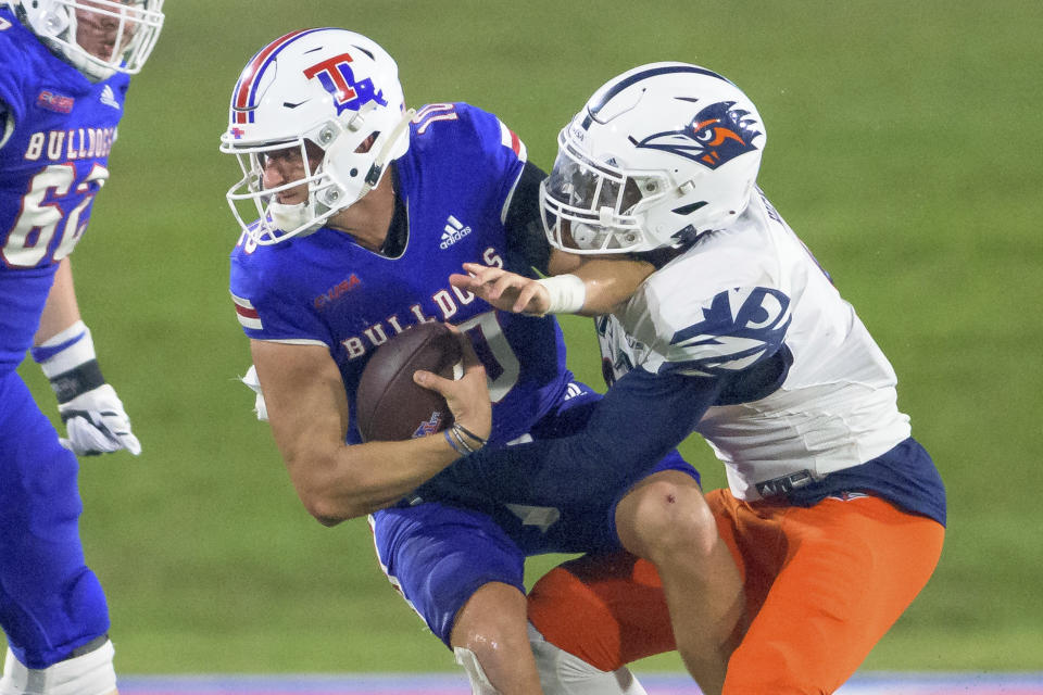 Louisiana Tech quarterback Austin Kendall (10) is sacked on third down by UTSA linebacker Clarence Hicks (9) in the first half of an NCAA college football game in Ruston, La., Saturday, Oct. 23, 2021. (AP Photo/Matthew Hinton)