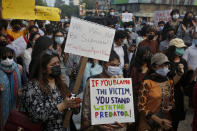 Women's rights activists demonstrate to condemn the violence against women in Lahore, Pakistan, Saturday, July 24, 2021. The beheading of a young woman in an upscale neighborhood of Pakistan's capital has shone a spotlight on the relentless violence against women in the country. Rights activists say such gender-based assaults are on the rise as Pakistan barrels toward greater religious extremism. (AP Photo/K.M. Chaudhry)