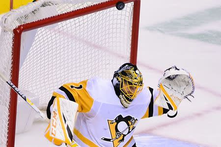 FILE PHOTO: Oct 27, 2018; Vancouver, British Columbia, CAN; The Vancouver Canucks shot the puck against Pittsburgh Penguins goaltender Casey DeSmith (1) during the third half at Rogers Arena. Anne-Marie Sorvin-USA TODAY Sports