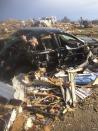 Extensive damage to homes and vehicles is pictured in the aftermath of tornado that touched down in Washington, Illinois November 17, 2013, in this photo courtesy of Anthony Khoury. A fast-moving storm system spawned multiple tornadoes in Illinois and Indiana, threatening some 53 million people across 10 Midwestern states on Sunday, U.S. weather officials said. Washington, Illinois is located 145 miles (233 km) southwest of Chicago. REUTERS/Anthony Khoury/Handout via Reuters (UNITED STATES - Tags: DISASTER ENVIRONMENT) ATTENTION EDITORS - THIS IMAGE HAS BEEN SUPPLIED BY A THIRD PARTY. IT IS DISTRIBUTED, EXACTLY AS RECEIVED BY REUTERS, AS A SERVICE TO CLIENTS. NO SALES. NO ARCHIVES. FOR EDITORIAL USE ONLY. NOT FOR SALE FOR MARKETING OR ADVERTISING CAMPAIGNS. MANDATORY CREDIT