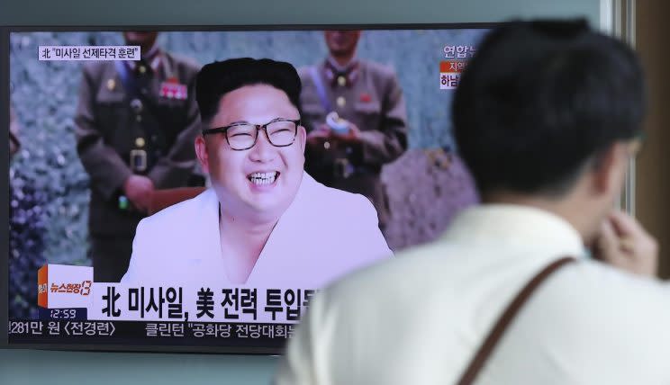 A man walks by a TV screen showing the North Korean leader Kim Jong Un at the Seoul Train Station in Seoul, South Korea (AP Photo/Lee Jin-man)