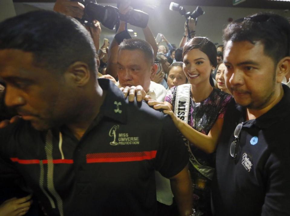 Newly crowned Miss Universe Pia Alonzo Wurtzbach, center right, is escorted out of the Philippine Senate after being presented with a Senate Resolution from Sen. President Franklin Drilon congratulating her for her victory in the 2015 Miss Universe during a ceremony Monday, Jan. 25, 2016 in Manila, Philippines. Wurtzbach was crowned Miss Universe on Dec. 20, 2015 but not before pageant host Steve Harvey incorrectly announced Miss Colombia as the winner at the Miss Universe pageant in Las Vegas. (AP Photo/Bullit Marquez)
