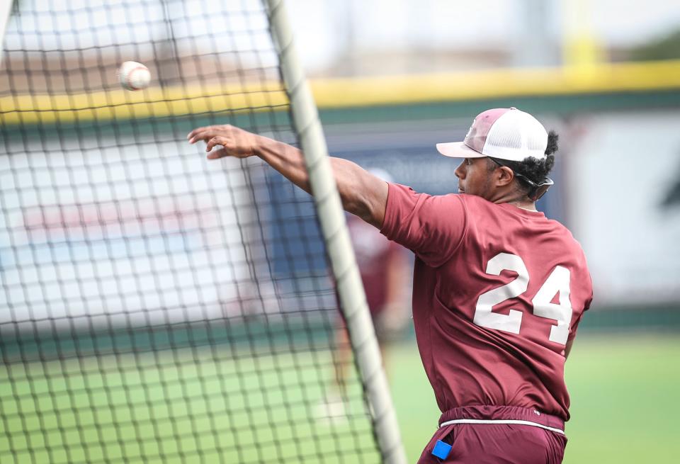 Sinton first baseman Jaquae Stewart passes to second base during practice at the high school's baseball field on May 4, 2022, in Texas.