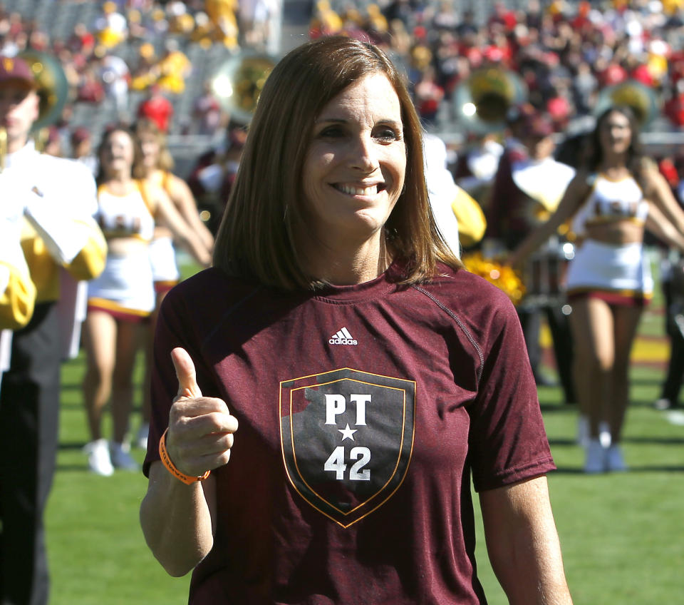 FILE - In this Nov. 3, 2018, file photo, U.S. Rep. Martha McSally, R-Ariz. gives a thumbs-up after singing the national anthem before an NCAA college football game between Arizona State and Utah in Tempe, Ariz. The congresswomen running for Arizona Senate are in their final campaign swing as McSally barnstormed across rural Arizona while Democratic Rep. Kyrsten Sinema dashed around metro Phoenix. The two candidates were trying to turn out every last voter in the neck-and-neck race. (AP Photo/Rick Scuteri, File)