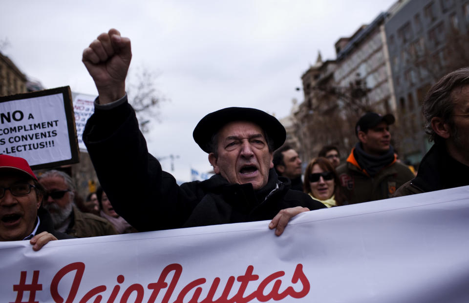 A man shouts slongans against the government's recently approved labor reforms during a demonstration in Barcelona, Spain, Friday Feb. 19, 2012. Marches organized by the country's main trade unions are taking place throughout Spain. (AP Photo/Emilio Morenatti)