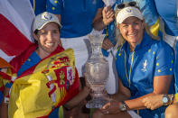 Europe's Team captain Suzann Pettersen, right, and Carlota Ciganda pose with the trophy after winning the Solheim Cup golf tournament in Finca Cortesin, near Casares, southern Spain, Sunday, Sept. 24, 2023. (AP Photo/Bernat Armangue)