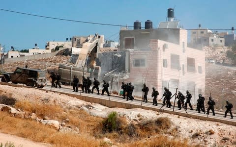 Palestinians accuse Israel of using security as a pretext to force them out of the area, meant to be under Palestinian Authority civilian control - Credit: HAZEM BADER/AFP/Getty Images