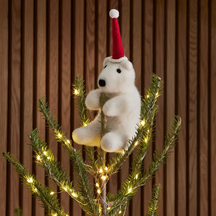 <p><a href="https://go.redirectingat.com?id=74968X1596630&url=https%3A%2F%2Fwww.westelm.com%2Fproducts%2Fhugging-polar-bear-tree-topper-d6631&sref=https%3A%2F%2Fwww.housebeautiful.com%2Fentertaining%2Fholidays-celebrations%2Fg45735039%2Fchristmas-tree-topper-ideas%2F" rel="nofollow noopener" target="_blank" data-ylk="slk:Shop Now;elm:context_link;itc:0;sec:content-canvas" class="link rapid-noclick-resp">Shop Now</a></p><p>Hugging Polar Bear Tree Topper</p><p>westelm.com</p><p>$40.00</p>