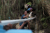 <p>People collect mountain spring water, after Hurricane Maria hit the island, in Corozal, Puerto Rico, Oct. 17, 2017. (Photo: Alvin Baez/Reuters) </p>